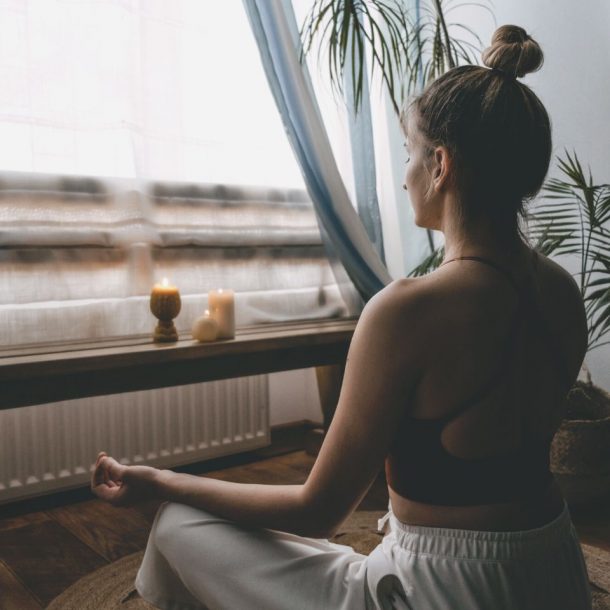 person meditating at home