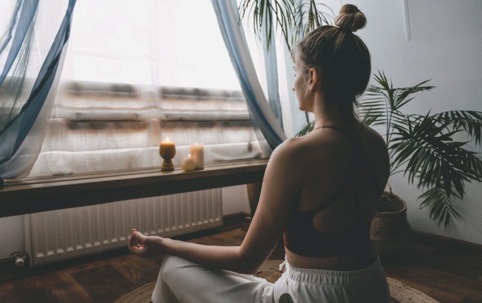 person meditating at home