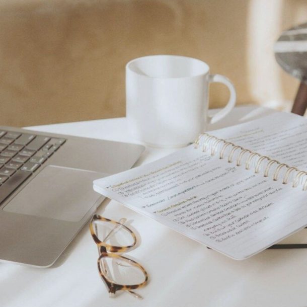 laptop next to notebook