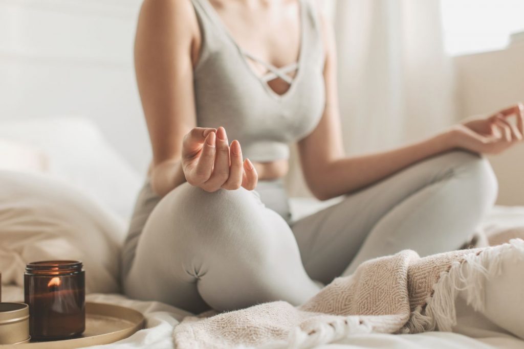 woman meditating at home