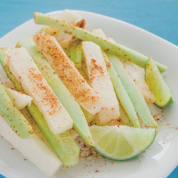 pepinos and jicama con chile, cucumber and jicamas with chili mexican snack spicy food on plate
