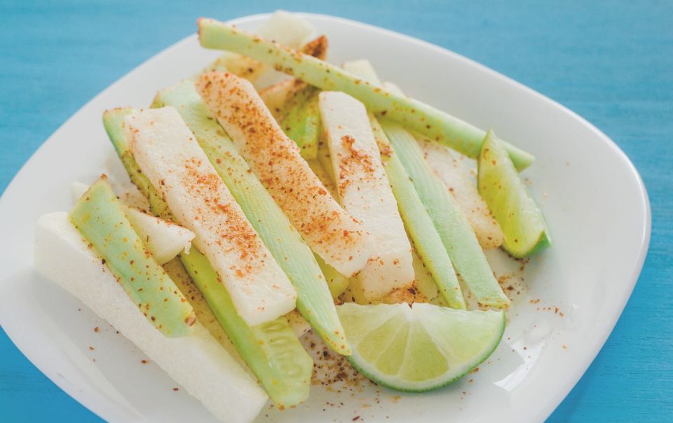 pepinos and jicama con chile, cucumber and jicamas with chili mexican snack spicy food on plate