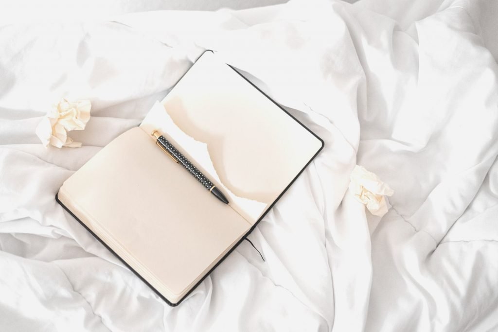 open journal on bed