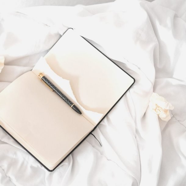 open journal on bed