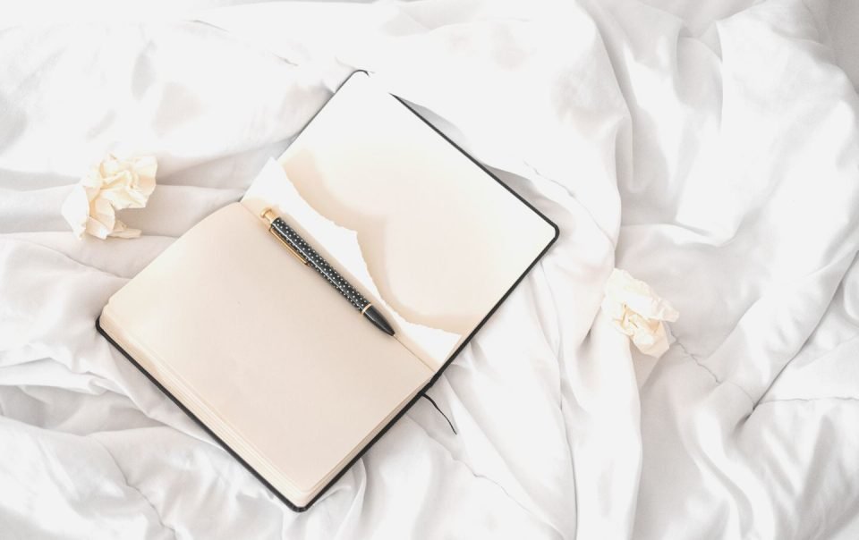 open journal on bed