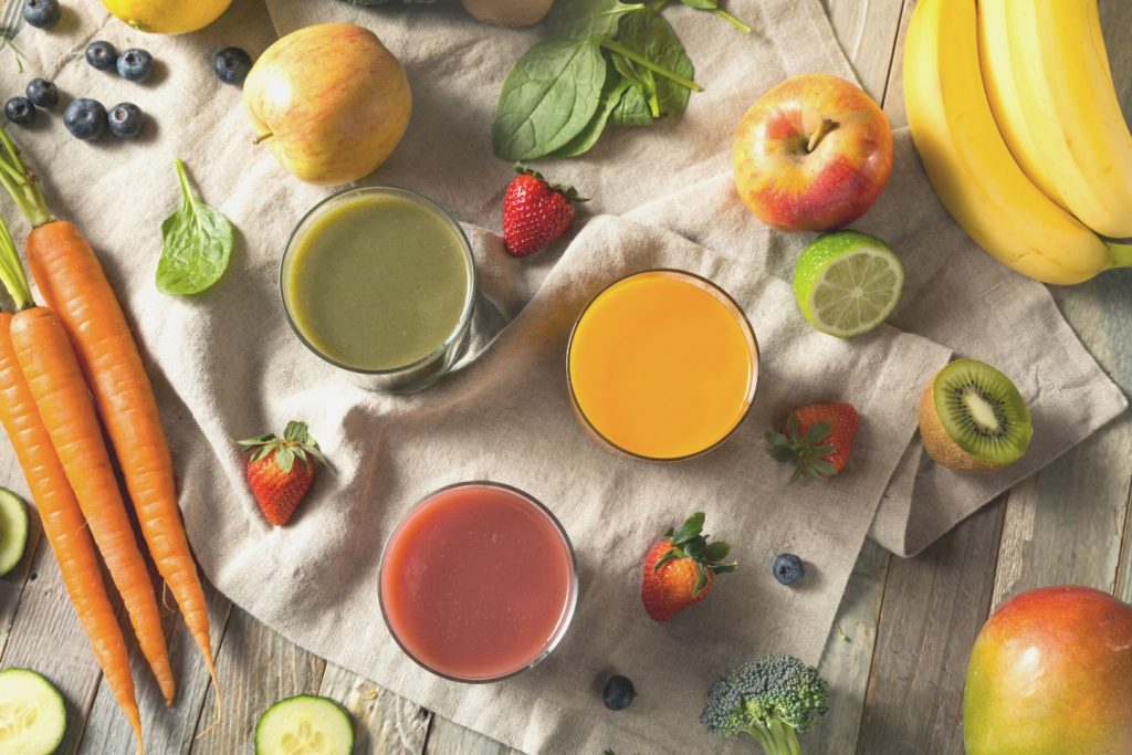 various fruits and juice on table