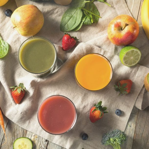 various fruits and juice on table
