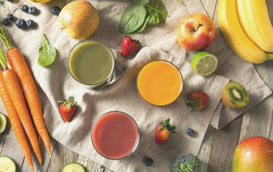 various fruits and juice on table