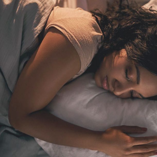 woman sleeping on pillow
