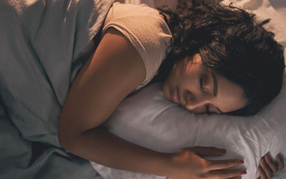 woman sleeping on pillow