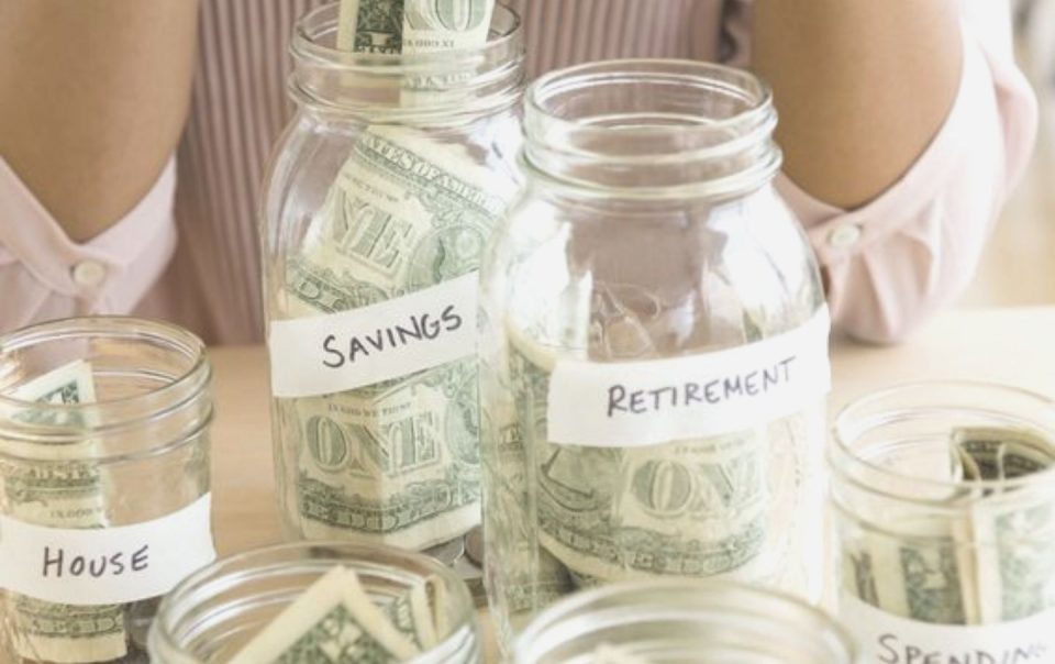 money in multiple jars with diiferent labels