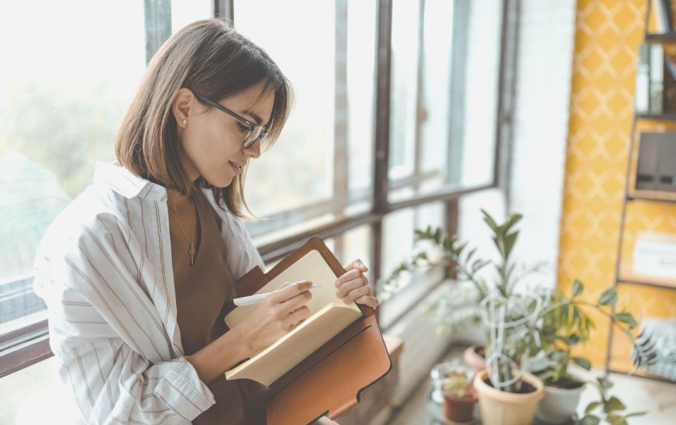 woman writing in journal