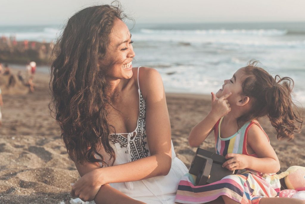 mom and daughter at beach