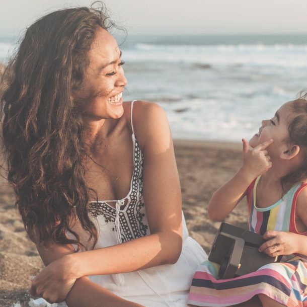 mom and daughter at beach